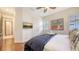 Bedroom boasts wood flooring, large picture window and accent wall at 6819 Dominion Ln, Lakewood Ranch, FL 34202