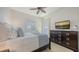 Cozy bedroom with plantation shutters and a flatscreen television, perfect for rest and relaxation at 6819 Dominion Ln, Lakewood Ranch, FL 34202
