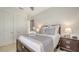 Comfortable bedroom featuring a decorative tray on the bed, and an ensuite bathroom at 6819 Dominion Ln, Lakewood Ranch, FL 34202