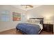 Comfortable primary bedroom suite with wood floors and soft lighting at 6819 Dominion Ln, Lakewood Ranch, FL 34202