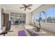 Bright exercise room featuring large windows, workout equipment, tiled floors, and a view of the outdoors at 6819 Dominion Ln, Lakewood Ranch, FL 34202
