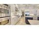 Updated kitchen with stainless steel appliances, gas range, stone countertops, and ample storage at 6819 Dominion Ln, Lakewood Ranch, FL 34202
