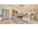 Open-concept living room featuring tiled flooring, neutral colors, and seamless transitions to the kitchen at 6819 Dominion Ln, Lakewood Ranch, FL 34202