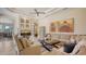 Bright living area featuring a fireplace, neutral tones and views of the backyard at 6819 Dominion Ln, Lakewood Ranch, FL 34202
