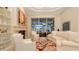 Bright living room with fireplace, comfortable seating, and view of the lanai at 6819 Dominion Ln, Lakewood Ranch, FL 34202