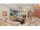 Inviting living room with comfortable seating and access to the lanai and pool area at 6819 Dominion Ln, Lakewood Ranch, FL 34202