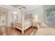 Bright main bedroom with hardwood floors and neutral colors at 6819 Dominion Ln, Lakewood Ranch, FL 34202