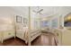 Relaxing main bedroom with a four-poster bed and hardwood floors at 6819 Dominion Ln, Lakewood Ranch, FL 34202