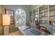 Bright home office with arched window and custom shelves at 6819 Dominion Ln, Lakewood Ranch, FL 34202