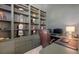 Built-in shelving in this home office is beautifully styled at 6819 Dominion Ln, Lakewood Ranch, FL 34202