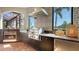 Outdoor dining area featuring a stainless grill, fireplace and decorative backsplash wall at 6819 Dominion Ln, Lakewood Ranch, FL 34202