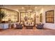 Outdoor living space featuring stylish furniture and access to interior living areas through glass at 6819 Dominion Ln, Lakewood Ranch, FL 34202