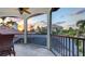 Enjoy sunset views from this screened-in patio overlooking the neighborhood, palm trees, and tile roofs at 6819 Dominion Ln, Lakewood Ranch, FL 34202
