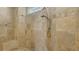 Shower features multiple shower heads and neutral tiling at 6819 Dominion Ln, Lakewood Ranch, FL 34202