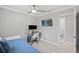 Bright bedroom with a computer desk and a view to the ensuite bathroom at 7141 37Th N Ave, St Petersburg, FL 33710
