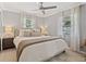 Bright bedroom with neutral decor features a ceiling fan, and soft lighting for a relaxing atmosphere at 7141 37Th N Ave, St Petersburg, FL 33710