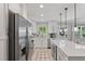 Well-appointed modern kitchen with an island, stainless steel appliances, and ample counter space at 7141 37Th N Ave, St Petersburg, FL 33710