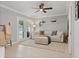 Cozy living room with stylish seating, a ceiling fan, and natural light from the glass doors at 7141 37Th N Ave, St Petersburg, FL 33710