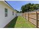 View of the side yard featuring a grassy area between the house and fences at 7141 37Th N Ave, St Petersburg, FL 33710