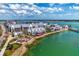 Beautiful lakefront community showcasing coastal-style buildings with stunning water views and manicured landscaping at 749 Tailwind Pl, Sarasota, FL 34240