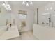 Modern bathroom showcasing a glass shower, vanity with sink, and stylish lighting at 749 Tailwind Pl, Sarasota, FL 34240