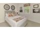 Cozy bedroom with comfortable bed, decorative pillows, and bright natural lighting at 749 Tailwind Pl, Sarasota, FL 34240