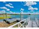 Community dock with lake access, providing opportunities for boating and water activities at 749 Tailwind Pl, Sarasota, FL 34240