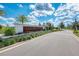 Welcoming community entrance with lush landscaping and clear signage under a sunny sky at 749 Tailwind Pl, Sarasota, FL 34240