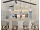An open concept kitchen with large center island, pendant lighting, and breakfast bar seating at 749 Tailwind Pl, Sarasota, FL 34240