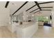 Spacious kitchen with white cabinetry, a large center island and stainless steel appliances at 749 Tailwind Pl, Sarasota, FL 34240
