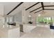 Spacious kitchen with an open view of the dining and living areas at 749 Tailwind Pl, Sarasota, FL 34240