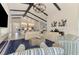 Bright living room featuring high ceilings, an open floor plan, and a seamless flow into the modern kitchen at 749 Tailwind Pl, Sarasota, FL 34240