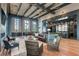 Stylish lounge with soaring ceilings, comfortable seating, and a modern aesthetic design at 749 Tailwind Pl, Sarasota, FL 34240