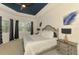 Charming main bedroom with blue tray ceilings, a ceiling fan, and natural light at 749 Tailwind Pl, Sarasota, FL 34240