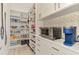 A well organized pantry with a variety of shelving and drawers for storage at 749 Tailwind Pl, Sarasota, FL 34240