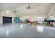 Spacious storage room filled with kayaks, surfboards, and other water equipment at 749 Tailwind Pl, Sarasota, FL 34240