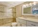 Updated bathroom featuring a glass-enclosed shower and modern vanity at 7876 Eagle Creek Dr, Sarasota, FL 34243
