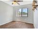Comfortable bedroom with wood floors, natural light, and a tranquil atmosphere for relaxation at 7876 Eagle Creek Dr, Sarasota, FL 34243