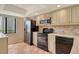 This kitchen features sleek black appliances and tile backsplash, complementing the modern aesthetic at 7876 Eagle Creek Dr, Sarasota, FL 34243