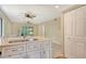 This modern kitchen features bright countertops, stainless sink, and is adjacent to the dining area at 7876 Eagle Creek Dr, Sarasota, FL 34243
