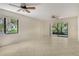 Bright living room with tile floors, ceiling fan, and sliding doors to a beautiful outdoor patio at 7876 Eagle Creek Dr, Sarasota, FL 34243
