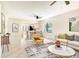 Bright, neutral living room with modern furnishings and a view into the dining area and kitchen at 7876 Eagle Creek Dr, Sarasota, FL 34243