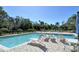 Community pool area with ample seating for residents to enjoy the outdoors at 7876 Eagle Creek Dr, Sarasota, FL 34243
