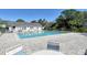 A well-maintained community pool with chairs and tables for residents to enjoy at 7876 Eagle Creek Dr, Sarasota, FL 34243