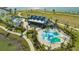 Aerial of community playground, splashpad, and covered picnic area at 7889 Mainsail Ln, Sarasota, FL 34240