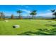 Outdoor recreation area with a lawn game and scenic views, perfect for community gatherings and activities at 7889 Mainsail Ln, Sarasota, FL 34240