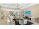 Spacious living room featuring marble floors, modern decor, and a cozy fireplace with entertainment center at 7889 Mainsail Ln, Sarasota, FL 34240