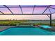 Stunning pool and spa with tranquil lake views, perfect for relaxation and entertaining at 7889 Mainsail Ln, Sarasota, FL 34240