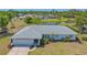 Beautiful aerial view of home showcasing mature landscaping and lush backyard at 7912 Estates Dr, Sarasota, FL 34243