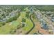 Aerial view of a golf course and neighboring community at 7912 Estates Dr, Sarasota, FL 34243